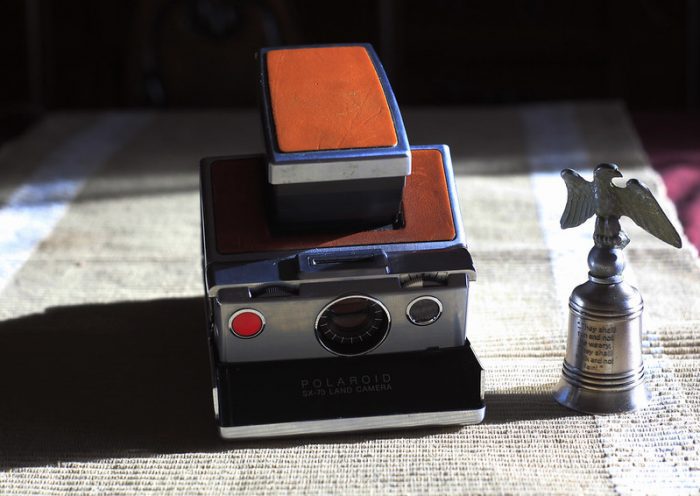 One top instant camera worth checking with orange design on top. Absolutely perfect!