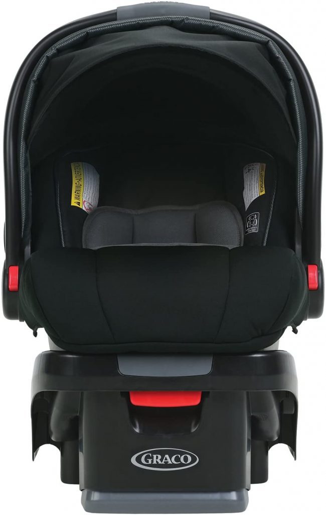 Infant car seat: A Graco infant car seat shown from a front view, all-black with side-impact protection and an adjustable canopy, mounted on its compatible base. Perfect infant car seat.