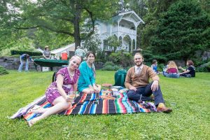 happy family spending time together having a picnic in the park