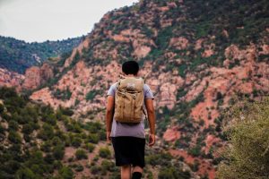 man using his backpack