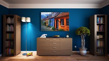 A bright painting on a dark wall, a great decoration idea.