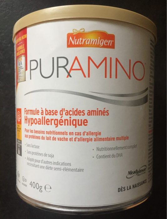 A 400g can PurAmino Formula. Fonts are color gray and orange. It's translated to other languages.