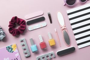 Summer nail designs polish placed together with nail designs accessories; ready to be used to experience an enjoyable summer vacation nail designs.
