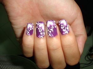 One of summer vacation nail designs is hearts in purple nail polish. This is a cute summer nail design. 