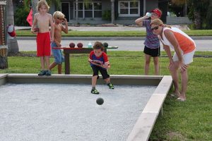 A family enjoying themselves while playing. Trying out the best kids games during summer. Games with kids.