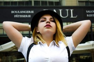 A woman with a simple black and white attire. Look for great outfits that fit your style, outfits that are comfortable and outfits that are appropriate.