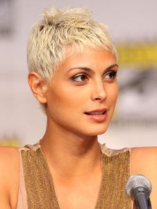 A beautiful woman is sporting an attractive blonde pixie cut, which also showcases subtle shades of gray. This fresh and fashionable haircut is perfect for the sunshine months ahead. This is among the top hairstyles for warm months