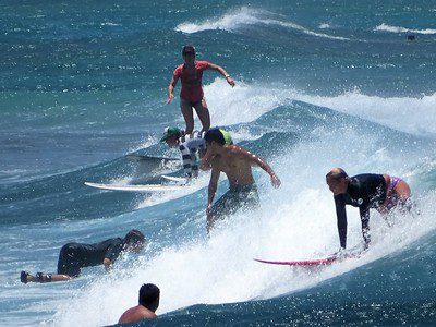 Unique vacations or beach vacations: Sea with too many surfers. Having a holiday with family.