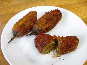 The air fryer jalapeno poppers are cooked before jalapenos' stuffed with cheese. When you cook a popper, jalapeno loses its hotness. If you want to make poppers spicy, then leave jalapenos seeds in while they’re frying.