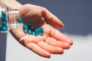 Prenatal Care: A woman holding some prenatal vitamins. A prenatal supplement is good for hair growth. Prenatal Supplement can benefit your hair; they can help you grow thicker, longer, and healthier locks by promoting healthy follicle production and reducing inflammation on your scalp. Prenatal care.