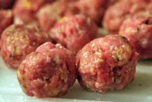 Raw turkey meatballs in round shape ready to be cooked 