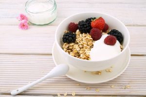 a bowl of oats with berries 