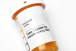 A pill bottle containing folic acid, a form of vitamin B which is important for the health of pregnant women