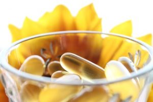 Prenatal vitamins placed inside a transparent bowl. Taking prenatals during pregnancy is important for the health of both the mom and the baby.