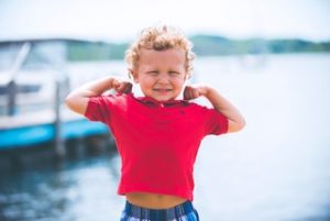 A young boy having a great time under the heat of the sun for a supplementary D3.