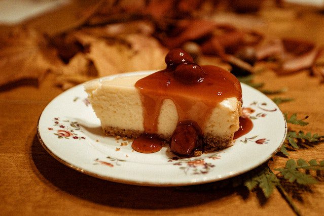 A delicious air fryer cheesecake topped with cherries.
