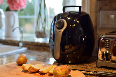 Mashed potatoes placed near an efficient kitchen appliance