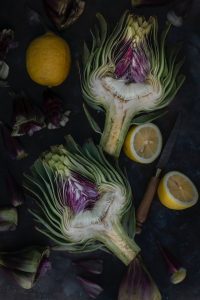 Preparations of air fryer artichoke hearts.