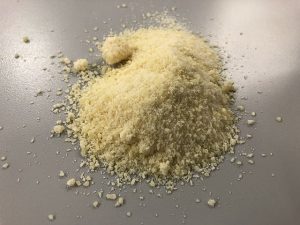 Parmesan cheese as main ingredient of chicken parmesan cooked in an air fryer