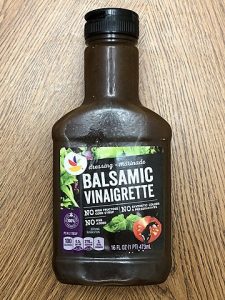 Image is a bottle of balsamic vinaigrette, which pairs really well with Brussels sprouts and other veggies.