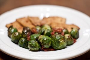 Image of a plate of delicious Brussels sprouts ready to be served.