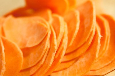 delicious thinly sliced sweet potato ready for the air fryer to be cooked.