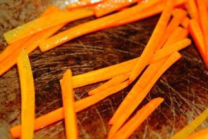 Carrot fries combines the goodness from the traditional counterpart with the healthy and guilt-free veggie, making a super snack. Delicious carrot fries in a fryer.