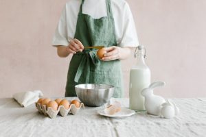 A person with apron prepares the ingredients before cooking. 