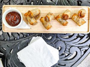 egg roll snacks with dipping sauce attractively plated