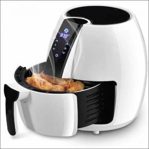 White air fryer with hot food inside