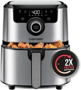 A stainless steel convection cooker with chicken wings inside