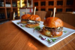 A trio of air fryer White Castle sliders on a rectangular plate. You can use an air fryer to achieve this. Air fryer is such a big help. 