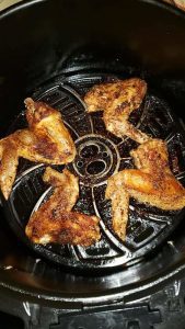 Chicken wings in an air fryer. 