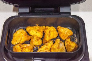 Cooking your prepared chicken in an air fryer by robert irvine.