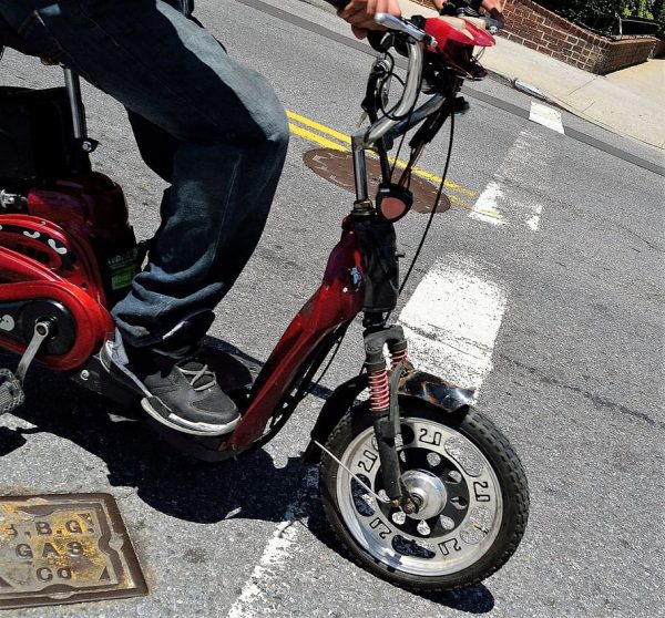 A two-wheeler vehicle in a road