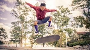 A skilled man showcases his prowess by demonstrating his skateboarding expertise - great physical benefits