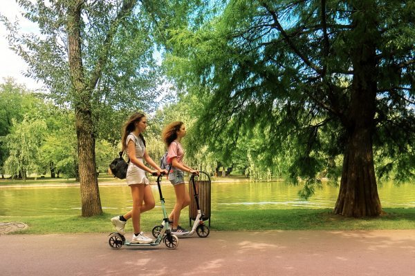 Using their electric scooters to go camping. 