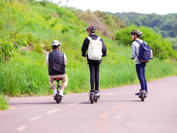 Group of friends going on a trip with their scooters