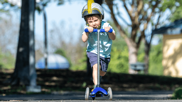 A toddler and a scooter. 