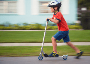 Image 1: A joyful kid dons a helmet, secures it, and kicks off on a vibrant scooter adventure. Wind in their hair, the scooter glides smoothly, laughter echoing as they navigate the streets. The helmet, a symbol of safety, accompanies them faithfully. With each twist and turn, the scooter becomes an extension of their joy. Parents watch proudly, knowing the importance of protection. The scooter helmets are a constant reminder of cautious excitement. As the sun sets, the kid returns, scooter parked, helmet off. A day filled with scoots and smiles, a perfect balance of thrill and safeguard.