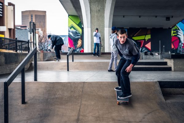 man skateboarding on a ramp inside a building