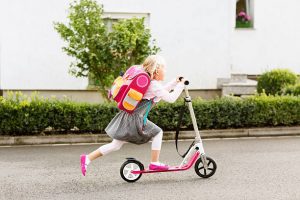 child is using her scooter, this is perfect