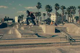 Ride skateboards in skateparks.