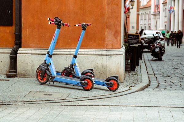 E-scooters parked on the side street.