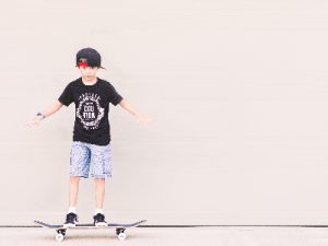 Practice on a kids' skateboard and later review progress.