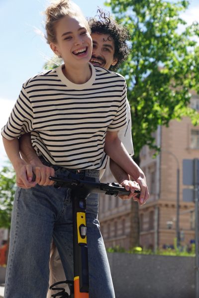 Couple on a scooter.