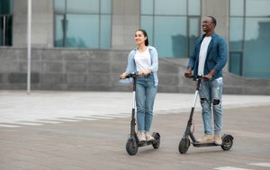 a scooting teacher and a teenager is practicing scooter