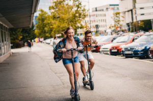 Friends riding scooter models for adventure.