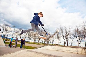 kid doing his first ever scooter trick - great