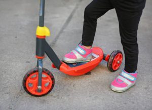 Vibrant red foldable scooter designed for kids, offering both style and convenience. Compact design ensures easy storage and transport